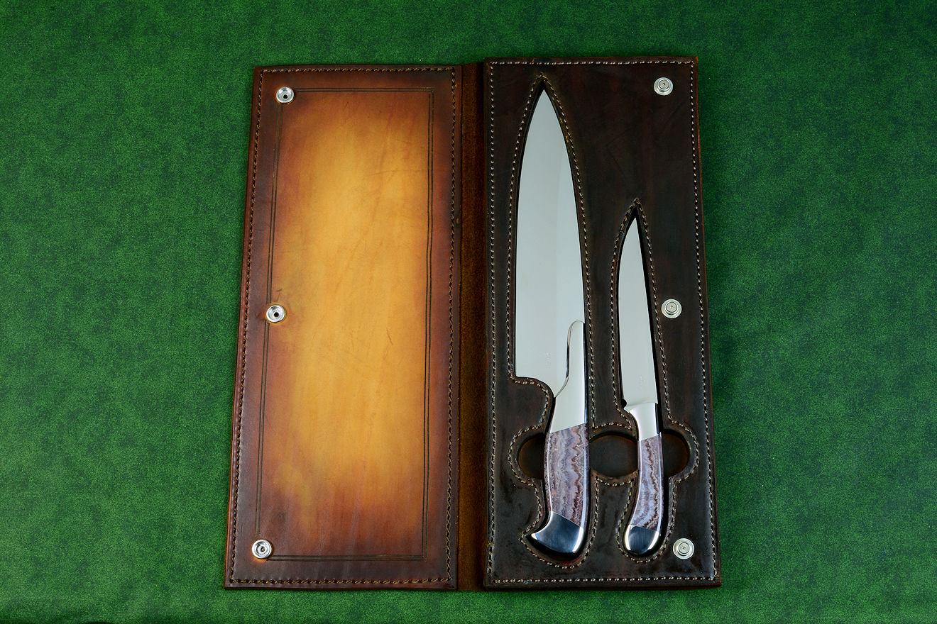 Concordia and Sanchez Chef's knives, obverse side view in T3 cryogenically treated 440C high chromium stainless steel blades, 304 stainless steel bolsters, Lace Amethyst gemstone handles, leather book case with top grain cover Concordia and Sanchez Chef's knives, obverse side view in T3 cryogenically treated 440C high chromium stainless steel blades, 304 stainless steel bolsters, Lace Amethyst gemstone handles, leather book case with top grain cover
